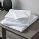 LodgMate 144 ct. White Flat Sheets - Full 81"x104" 3